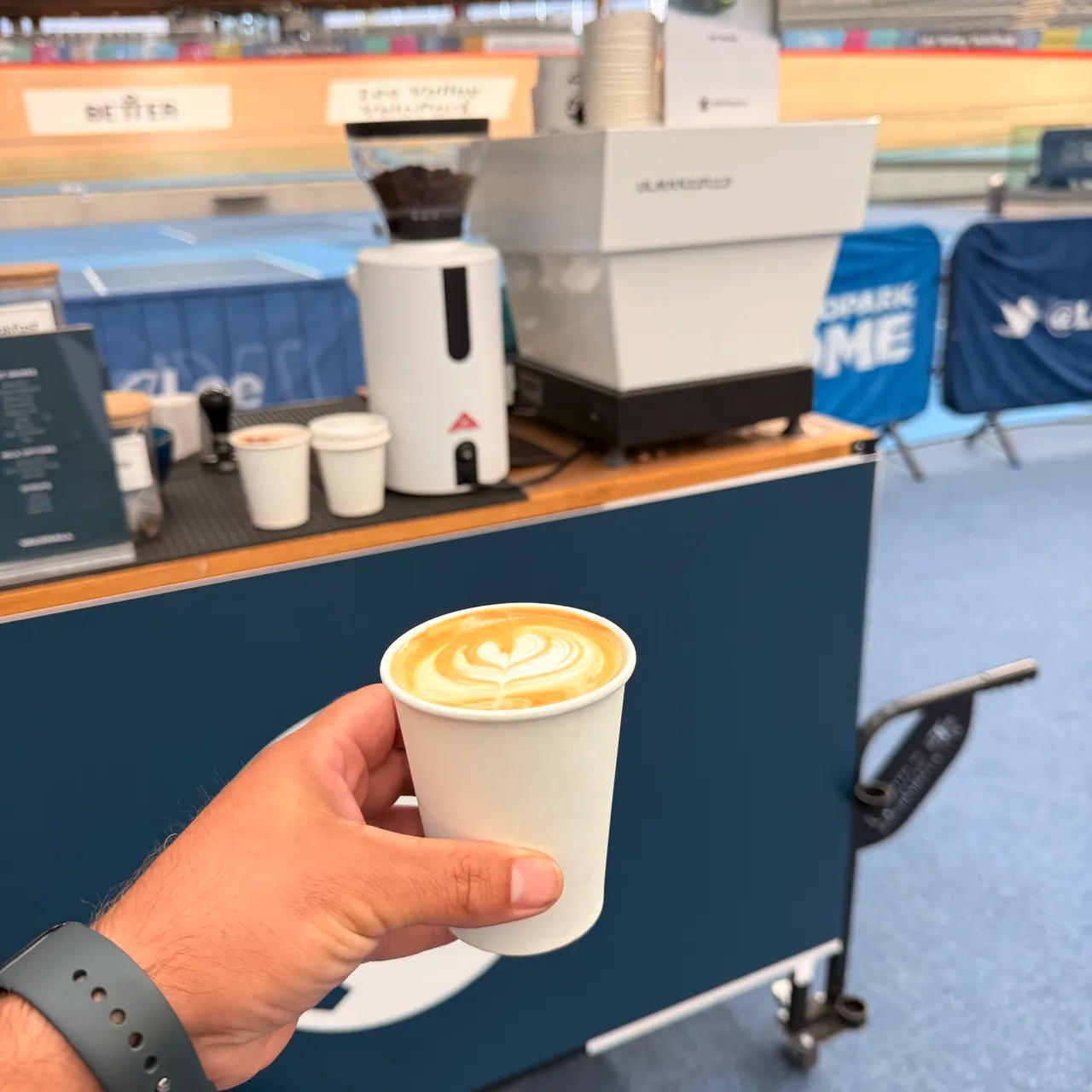 Professional event barista serving coffee at the Vauxhall and Team GB activation